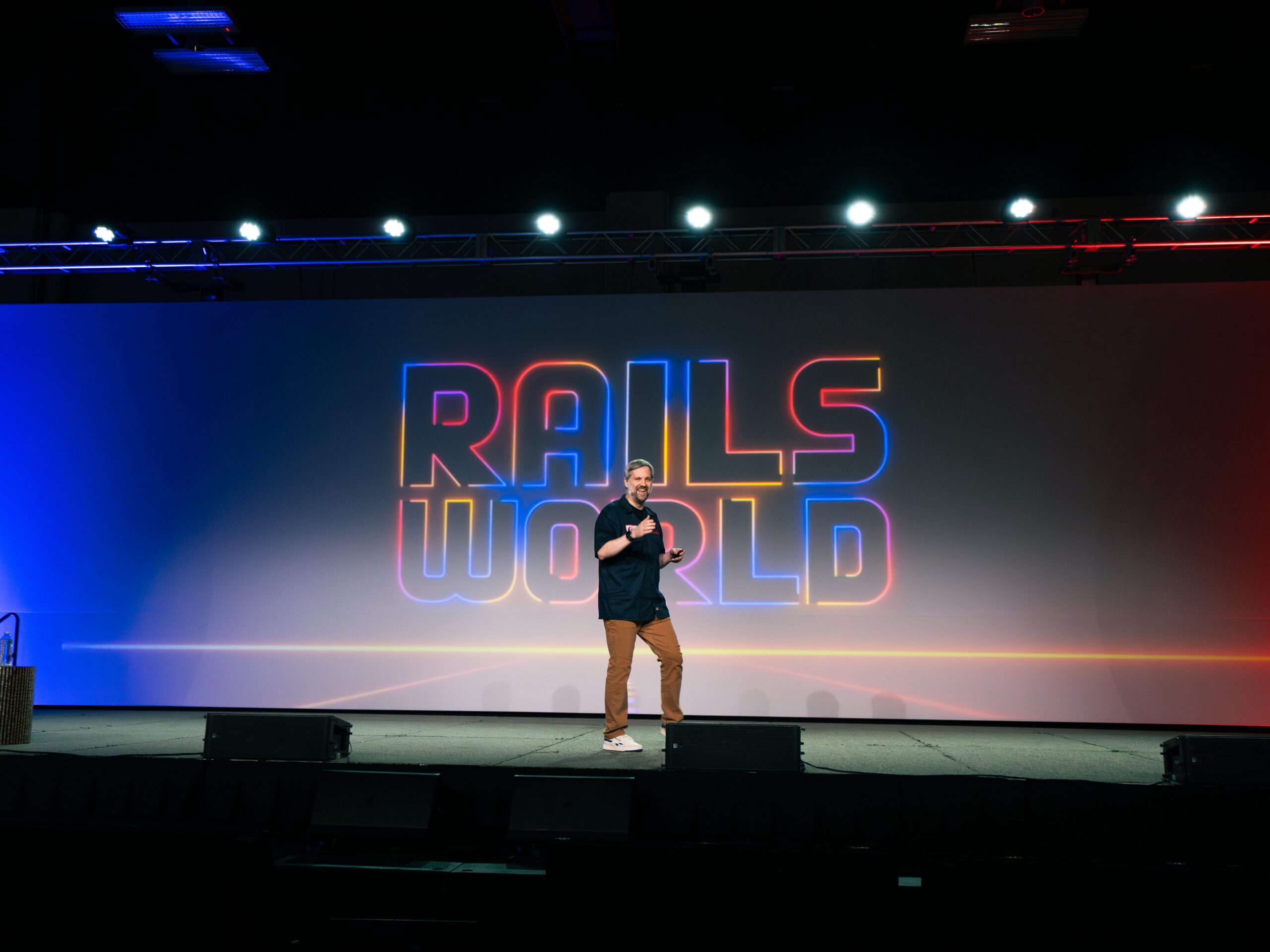 Speaker presenting on stage at Rails World 2026